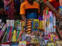 A shopkeeper sells firecrackers at a market ahead of the Diwali festival in Kolkata, India, on October 30, 2024. (