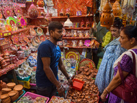 People buy clay lamps at a market ahead of the Diwali festival in Kolkata, India, on October 30, 2024. (