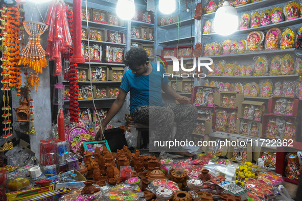 People buy clay lamps at a market ahead of the Diwali festival in Kolkata, India, on October 30, 2024. 