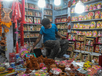 People buy clay lamps at a market ahead of the Diwali festival in Kolkata, India, on October 30, 2024. (