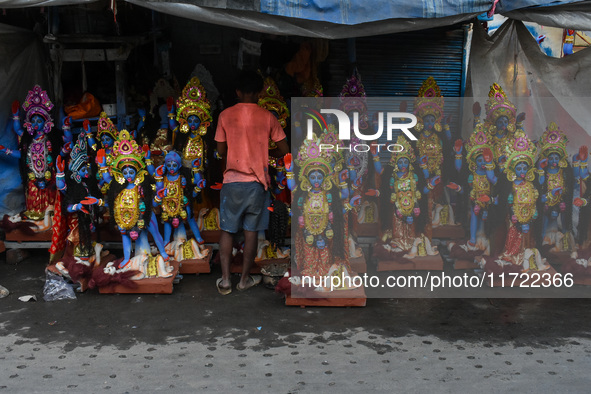 Artisans give final touches to idols of Goddess Kali ahead of the Kali Puja festival celebration in Kolkata, India, on October 30, 2024. 