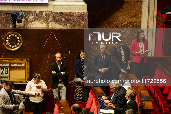 Deputies of La France Insoumise are seen during the public session following the discussion of the social security financing bill at the Nat...