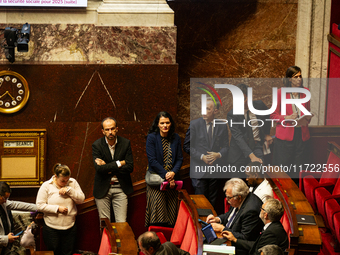 Deputies of La France Insoumise are seen during the public session following the discussion of the social security financing bill at the Nat...