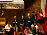 Deputies of La France Insoumise are seen during the public session following the discussion of the social security financing bill at the Nat...