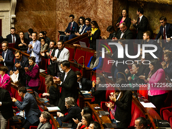 In Paris, France, on October 29, 2024, deputies of the La France Insoumise group applaud the speech of Manuel Bompard during the public sess...