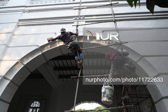 Workers renovate the main building of the International Criminal Tribunal in Dhaka, Bangladesh, on October 30, 2024. 