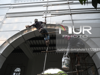 Workers renovate the main building of the International Criminal Tribunal in Dhaka, Bangladesh, on October 30, 2024. (