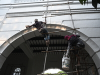 Workers renovate the main building of the International Criminal Tribunal in Dhaka, Bangladesh, on October 30, 2024. (