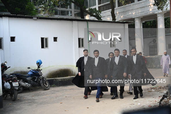 The Chief Prosecutor and other prosecutors walk in front of the International Crimes Tribunal (ICT) in Dhaka, Bangladesh, on October 30, 202...