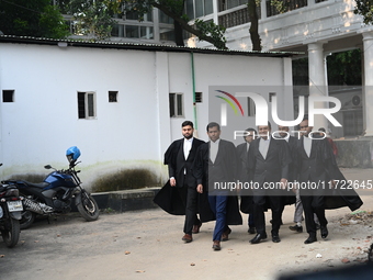 The Chief Prosecutor and other prosecutors walk in front of the International Crimes Tribunal (ICT) in Dhaka, Bangladesh, on October 30, 202...