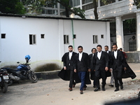 The Chief Prosecutor and other prosecutors walk in front of the International Crimes Tribunal (ICT) in Dhaka, Bangladesh, on October 30, 202...