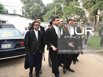 The Chief Prosecutor and other prosecutors walk in front of the International Crimes Tribunal (ICT) in Dhaka, Bangladesh, on October 30, 202...