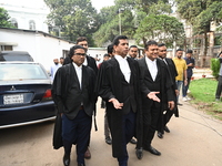 The Chief Prosecutor and other prosecutors walk in front of the International Crimes Tribunal (ICT) in Dhaka, Bangladesh, on October 30, 202...