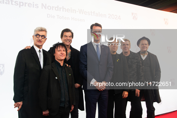 Wim Wenders, a German filmmaker, Stephen George Ritchie, Andreas Frege alias Campino, Andreas Meurer, Andrea, members of the rock band Die T...