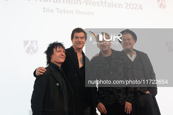 Stephen George Ritchie, Andreas Frege alias Campino, Andreas Meurer, and Andrea, members of the rock band Die Toten Hosen, pose for pictures...