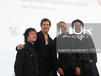 Stephen George Ritchie, Andreas Frege alias Campino, Andreas Meurer, and Andrea, members of the rock band Die Toten Hosen, pose for pictures...