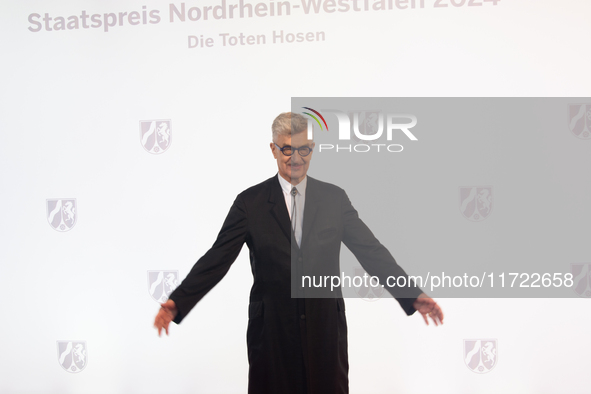 Wim Wenders, a German filmmaker, poses for pictures on the red carpet of Roncalli's Apollo Variety Theatre in Duesseldorf, Germany, on Octob...