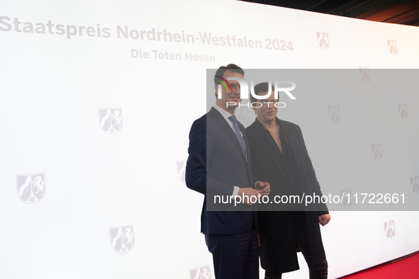 Hendrik Josef Wust, the minister president of NRW, and Andreas Frege, also known as Campino, a member of the rock band Die Toten Hosen, pose...