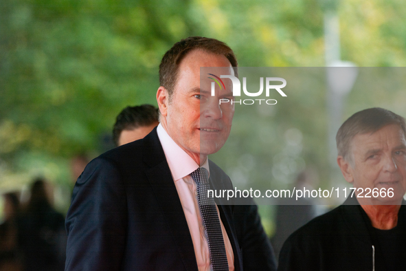 Stephan Keller, the mayor of Duesseldorf, poses for pictures on the red carpet of Roncalli's Apollo Variety Theatre in Duesseldorf, Germany,...