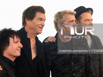 Stephen George Ritchie, Andreas Frege alias Campino, Andreas Meurer, and Andrea, members of the rock band Die Toten Hosen, pose for pictures...