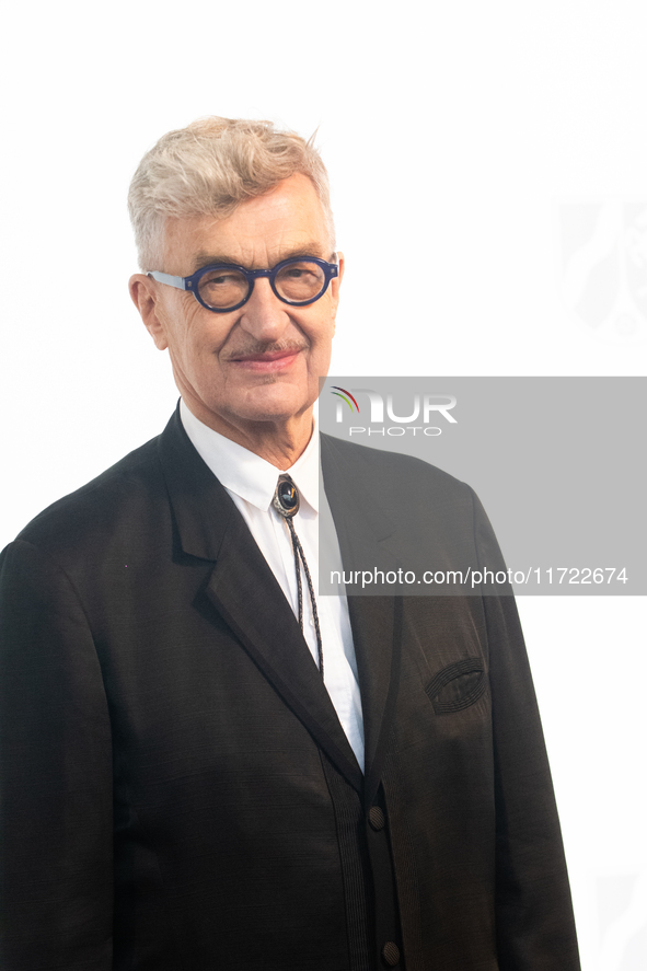 Wim Wenders, a German filmmaker, poses for pictures on the red carpet of Roncalli's Apollo Variety Theatre in Duesseldorf, Germany, on Octob...