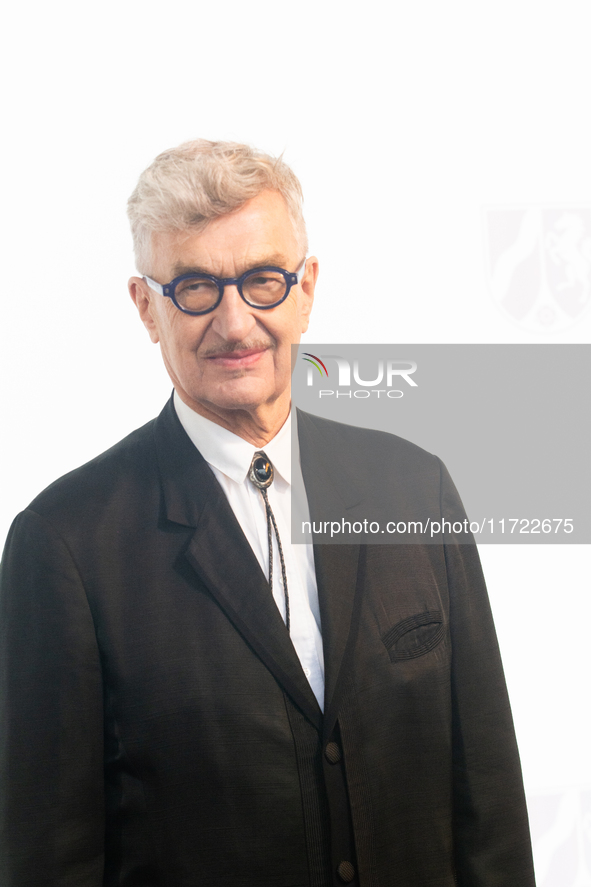 Wim Wenders, a German filmmaker, poses for pictures on the red carpet of Roncalli's Apollo Variety Theatre in Duesseldorf, Germany, on Octob...