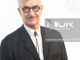 Wim Wenders, a German filmmaker, poses for pictures on the red carpet of Roncalli's Apollo Variety Theatre in Duesseldorf, Germany, on Octob...