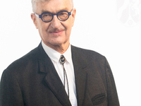 Wim Wenders, a German filmmaker, poses for pictures on the red carpet of Roncalli's Apollo Variety Theatre in Duesseldorf, Germany, on Octob...