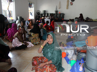 Rohingya refugees rest in a temporary shelter at the Pantai Labu District Office in Deli Serdang Regency, North Sumatra, Indonesia, on Octob...