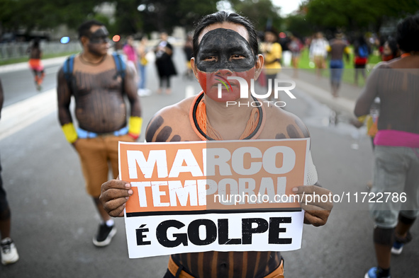 Indigenous leaders hold an act in Brasilia, Brazil, on October 30, 2024, to protest against PEC48, which defines a time frame for demarcatin...