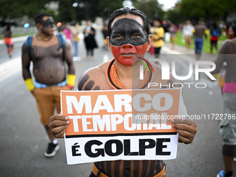 Indigenous leaders hold an act in Brasilia, Brazil, on October 30, 2024, to protest against PEC48, which defines a time frame for demarcatin...