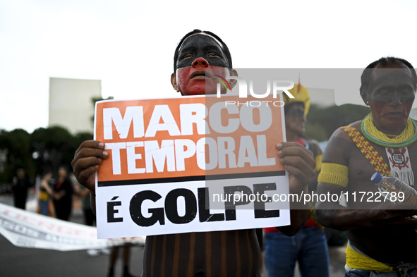 Indigenous leaders hold an act in Brasilia, Brazil, on October 30, 2024, to protest against PEC48, which defines a time frame for demarcatin...