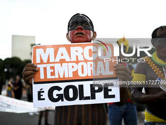 Indigenous leaders hold an act in Brasilia, Brazil, on October 30, 2024, to protest against PEC48, which defines a time frame for demarcatin...