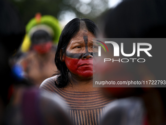 Indigenous leaders hold an act in Brasilia, Brazil, on October 30, 2024, to protest against PEC48, which defines a time frame for demarcatin...