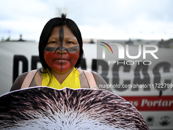 Indigenous leaders hold an act in Brasilia, Brazil, on October 30, 2024, to protest against PEC48, which defines a time frame for demarcatin...