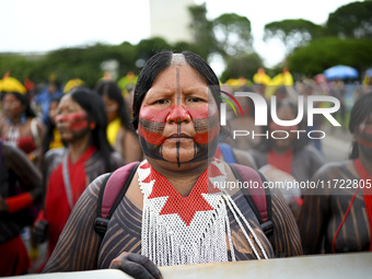 Indigenous leaders hold an act in Brasilia, Brazil, on October 30, 2024, to protest against PEC48, which defines a time frame for demarcatin...