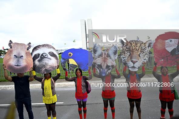 Indigenous leaders hold an act in Brasilia, Brazil, on October 30, 2024, to protest against PEC48, which defines a time frame for demarcatin...