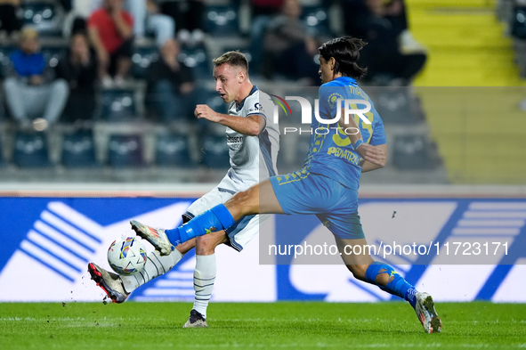 Youssef Maleh of Empoli FC and Davide Frattesi of FC Internazionale compete for the ball during the Serie A Enilive match between Empoli FC...