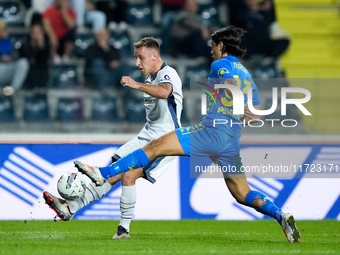 Youssef Maleh of Empoli FC and Davide Frattesi of FC Internazionale compete for the ball during the Serie A Enilive match between Empoli FC...