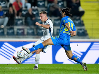 Youssef Maleh of Empoli FC and Davide Frattesi of FC Internazionale compete for the ball during the Serie A Enilive match between Empoli FC...