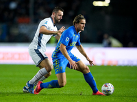 Lorenzo Colombo of Empoli FC and Stefan de Vrij of FC Internazionale compete for the ball during the Serie A Enilive match between Empoli FC...