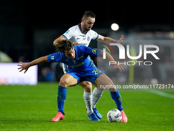 Lorenzo Colombo of Empoli FC and Stefan de Vrij of FC Internazionale compete for the ball during the Serie A Enilive match between Empoli FC...