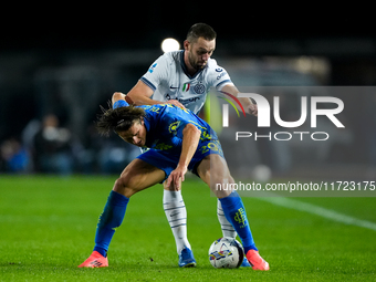 Lorenzo Colombo of Empoli FC and Stefan de Vrij of FC Internazionale compete for the ball during the Serie A Enilive match between Empoli FC...