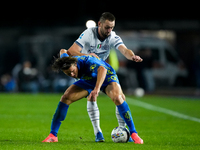 Lorenzo Colombo of Empoli FC and Stefan de Vrij of FC Internazionale compete for the ball during the Serie A Enilive match between Empoli FC...