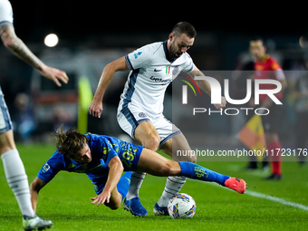 Lorenzo Colombo of Empoli FC and Stefan de Vrij of FC Internazionale compete for the ball during the Serie A Enilive match between Empoli FC...