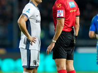 Lautaro Martinez of FC Internazionale protests with referee Matteo Marchetti during the Serie A Enilive match between Empoli FC and FC Inter...