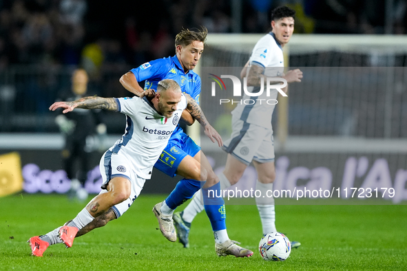 Jacopo Fazzini of Empoli FC and Federico Dimarco of FC Internazionale compete for the ball during the Serie A Enilive match between Empoli F...