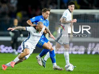 Jacopo Fazzini of Empoli FC and Federico Dimarco of FC Internazionale compete for the ball during the Serie A Enilive match between Empoli F...