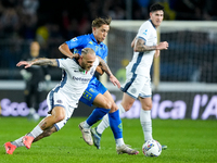 Jacopo Fazzini of Empoli FC and Federico Dimarco of FC Internazionale compete for the ball during the Serie A Enilive match between Empoli F...