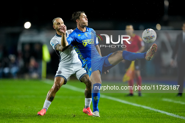 Federico Dimarco of FC Internazionale and Ola Solbakken of Empoli FC compete for the ball during the Serie A Enilive match between Empoli FC...